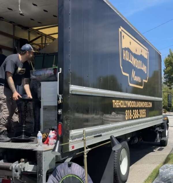 Hollywoodland Movers team loading a moving truck.