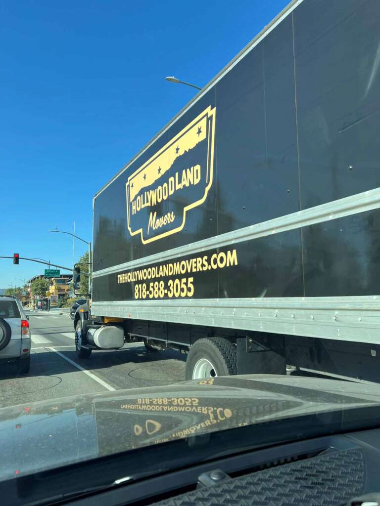 IMG_4853 Hollywoodland Movers moving truck at a stoplight.