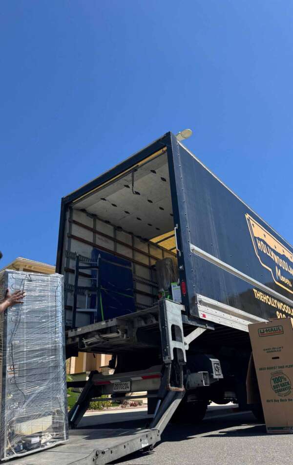 IMG_4874 Hollywoodland Movers truck being loaded with wrapped shelving